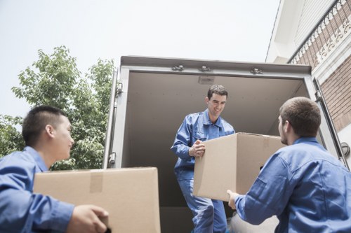 Careful loading of household furniture into a removals van in Isleworth
