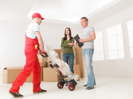 Removal team loading furniture for a move in Isleworth