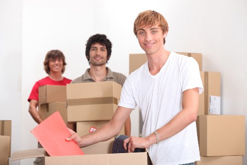 Business removals team loading office equipment for an Isleworth move
